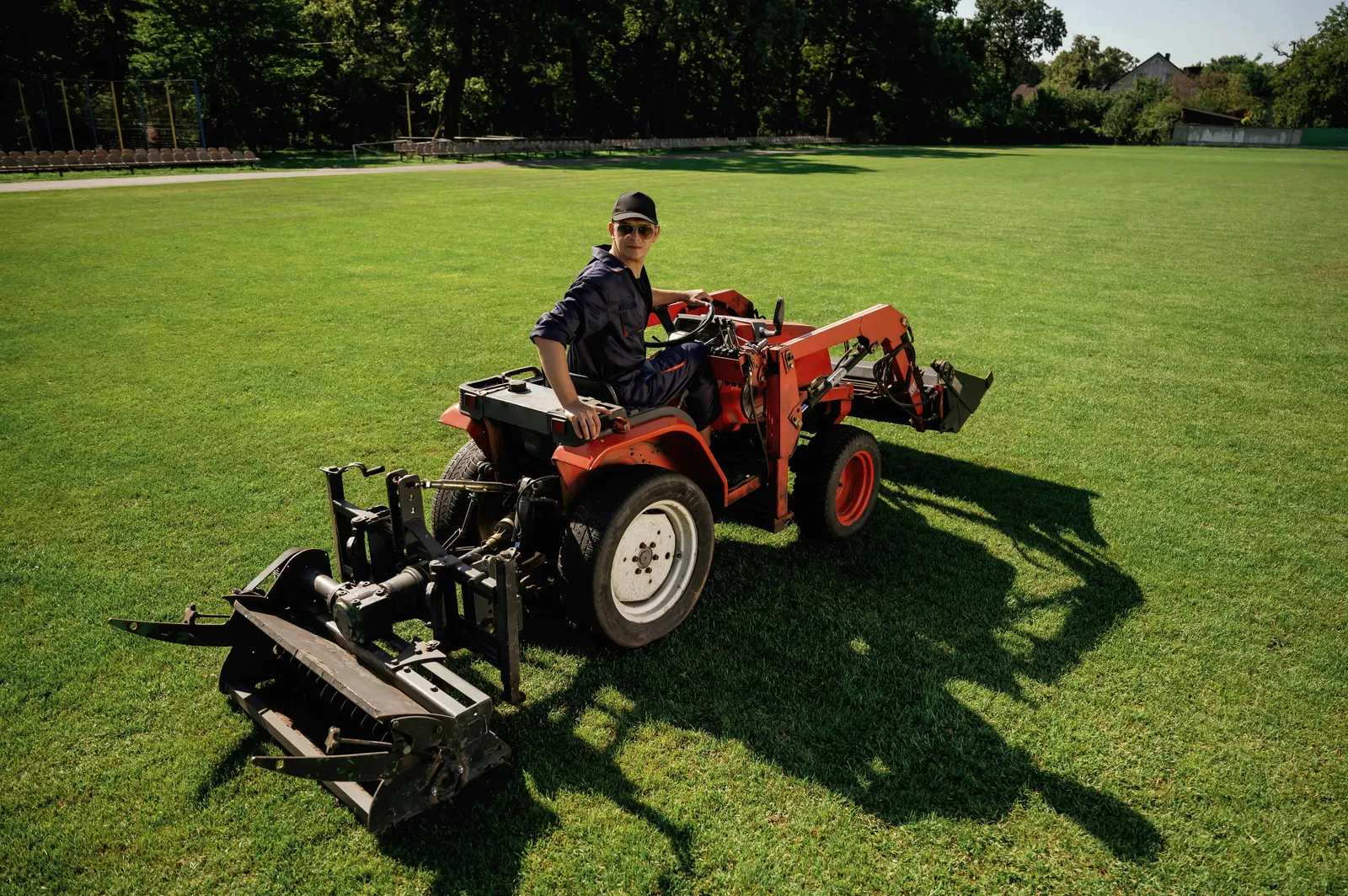 loan work man is with utility tractor with grass 2024 09 09 18 54 10 utc min